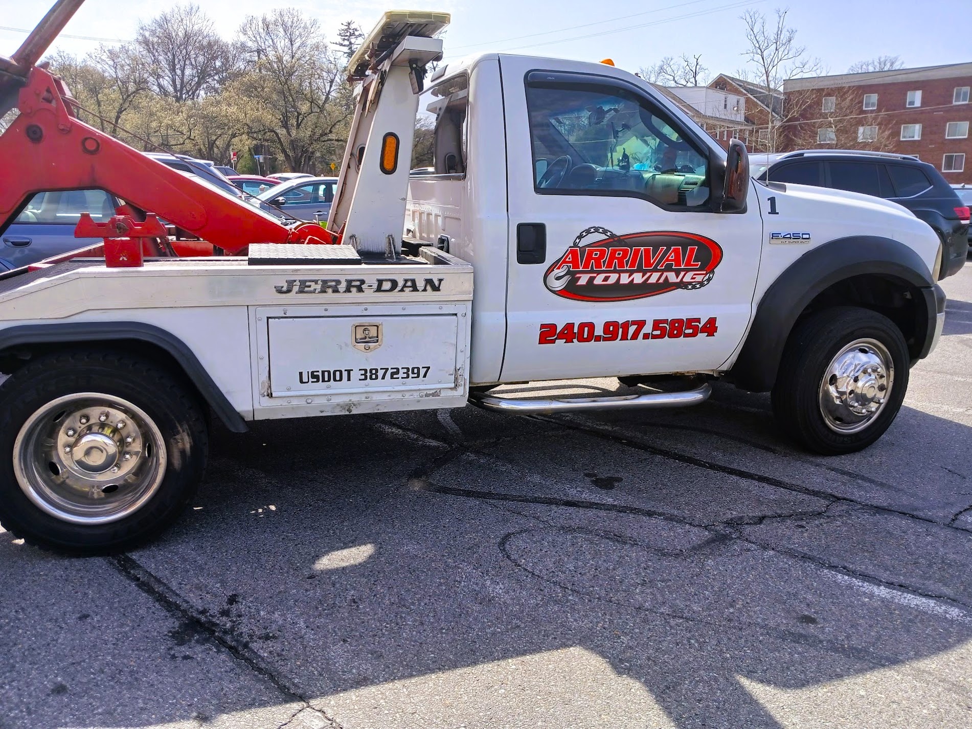 Arrival Towing LLC tow truck providing roadside assistance